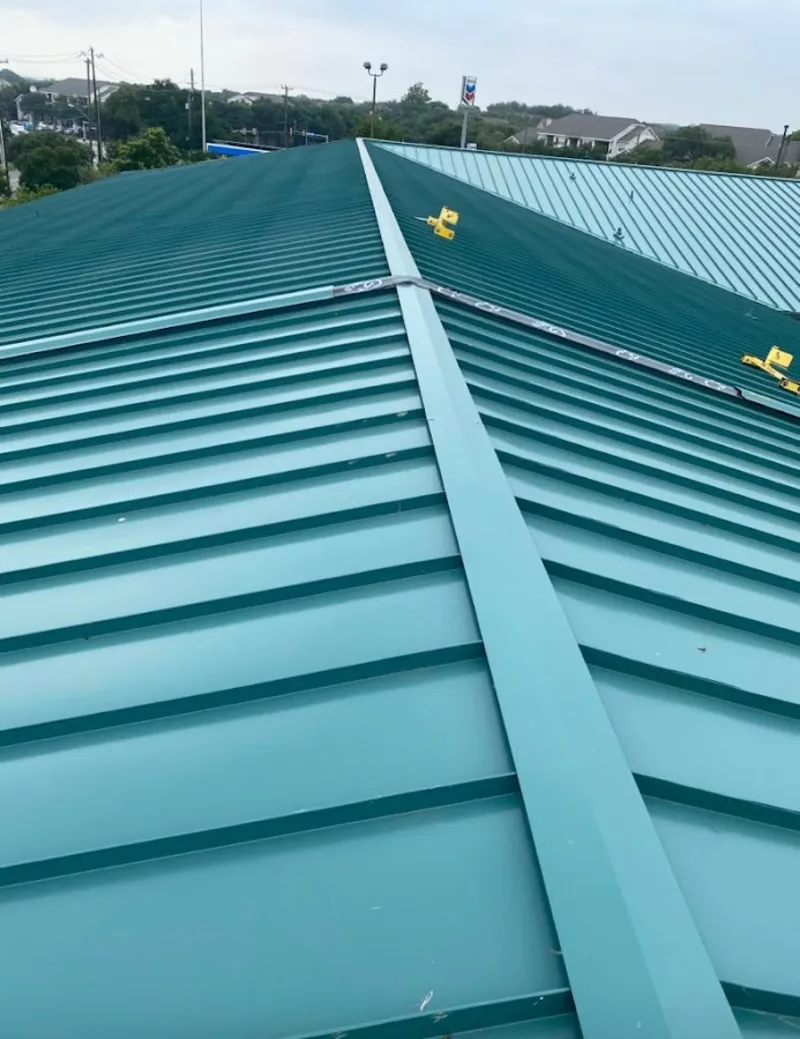 Green commercial metal roof ridge and valley for Metal Roof Repair in Lake St. Louis