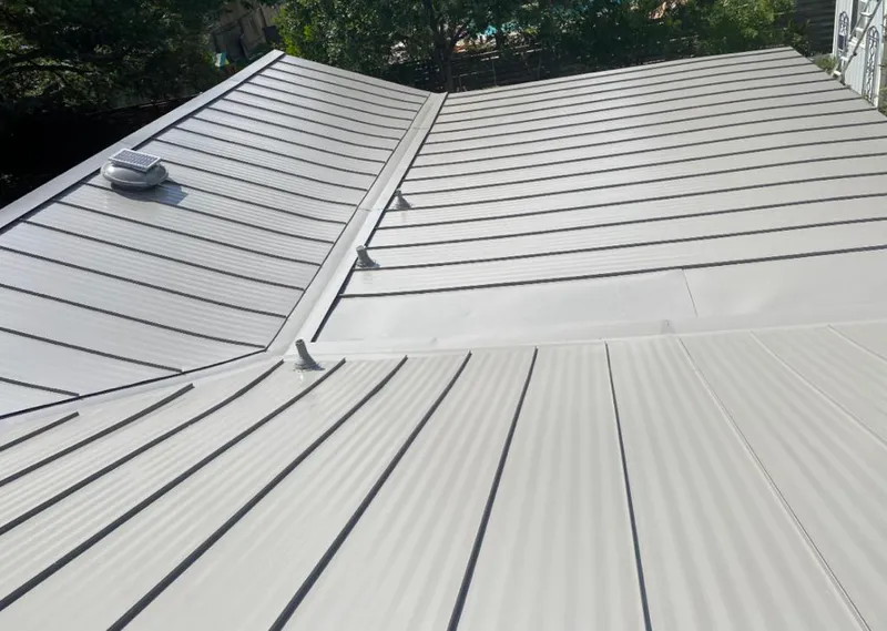 Solar attic fan installed on a metal roof for Roof Ventilation in Lake St. Louis